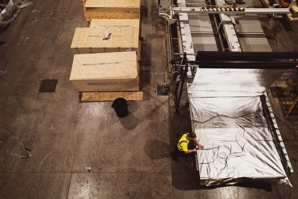Interior of NI Timberframes factory with timber panel assembly
